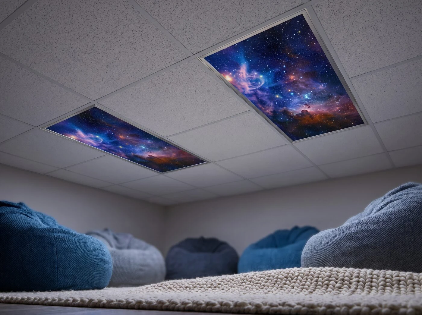 Sensory room with astronomy nebula light covers in two ceiling troffers